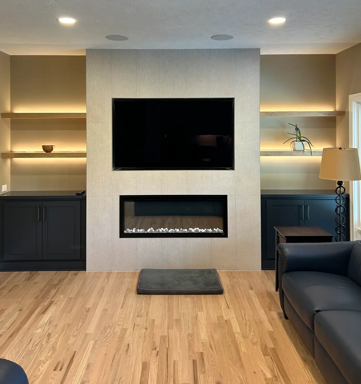 Custom fireplace surround with tile and built-in shelving